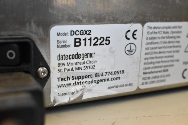 Date Code Genie DCGX2 label printer, Model DCGX2, Serial B11225. Manufacturer and compliance info on label.