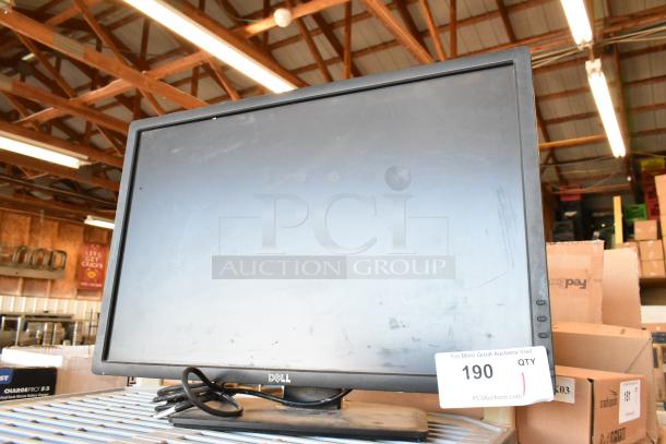Dell U2412Mb monitor in used condition, visible loose cables, and auction tag number 190 attached.