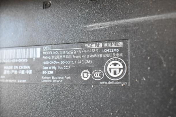 Label on back of Dell U2412Mb computer, shows model number, power rating, 2014 manufacture date, and origin in China.