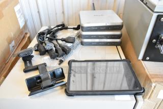 Lot with AKG SM-T720 tablet, three Mako 6600 routers, cables, and accessories. Mixed condition, visible wear.