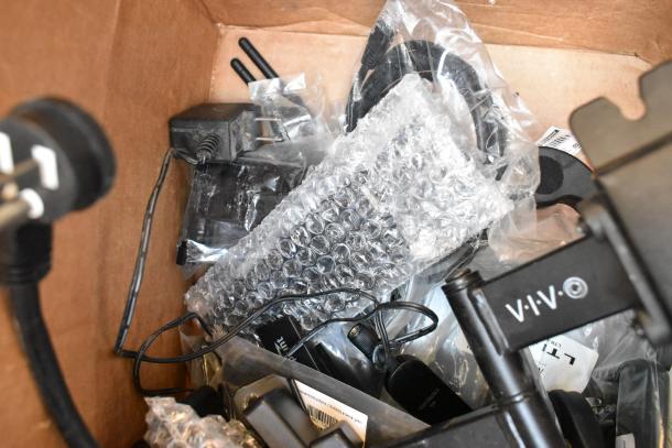 Box containing AKG SM-T720 Tablet, Mako Routers, various electronics in bubble wrap and plastic bags.