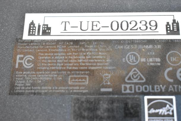 Six assorted tablets including Samsung, Lenovo TB-8504F model shown. Features labels and compliance markings. Good condition.