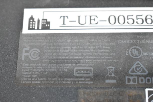 Label on Lenovo tablet model TB-8504F, shows FCC compliance and power input details, minor wear visible.