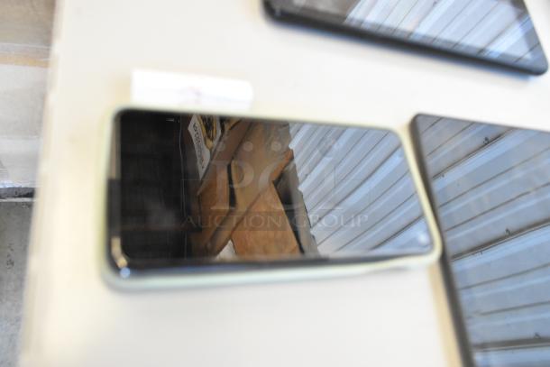 Six various tablets displayed; condition appears used. No visible brand or model identifiers. Auction lot includes all tablets.