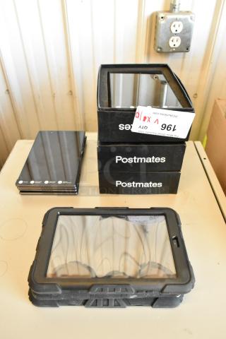 10 mixed tablets, including Samsung, in various conditions. Includes protective cases and boxes labeled "Postmates."