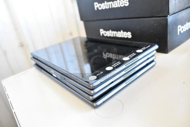 Stack of four various tablets, including Samsung, shown in good condition. Includes IPS HD and Wi-Fi labels.