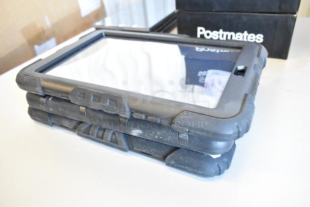 Stack of 10 tablets, including Samsung, with rugged black cases. Used condition. Auction set includes 10 units.