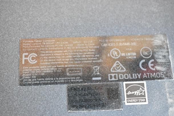 Label on back of Lenovo TB-8504F tablet showing FCC compliance, Dolby Atmos logo, and Energy Star certification.