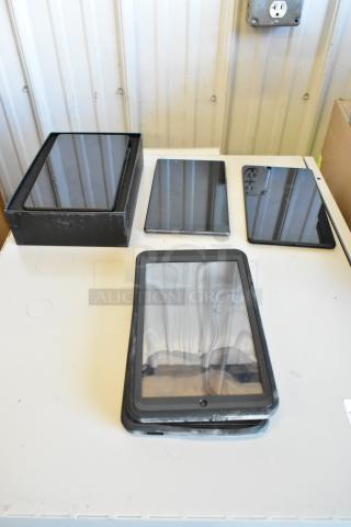 Five assorted tablets, including Samsung, on display. Some have visible wear, showing screens and edges. Mixed conditions.