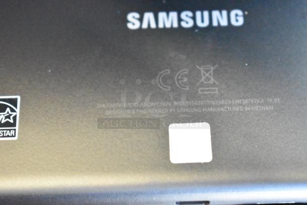 Close-up of a Samsung tablet back showing model SM-T387V and labels, part of a lot of 5 various tablets for auction.