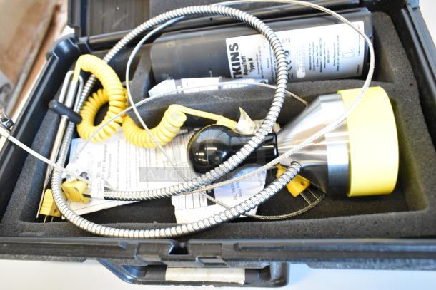 Atkins AquaTuff 351 thermometer set in protective hard case with coiled cables and probe. Includes manuals and accessories.