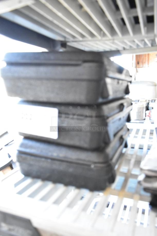 Three Atkins AquaTuff 351 thermometers in hard cases, stacked. Ideal for accurate temperature measurements.