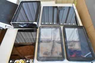 Six various tablets, including Samsung, with visible screens and cases, mixed conditions. Boxed and unboxed in auction.
