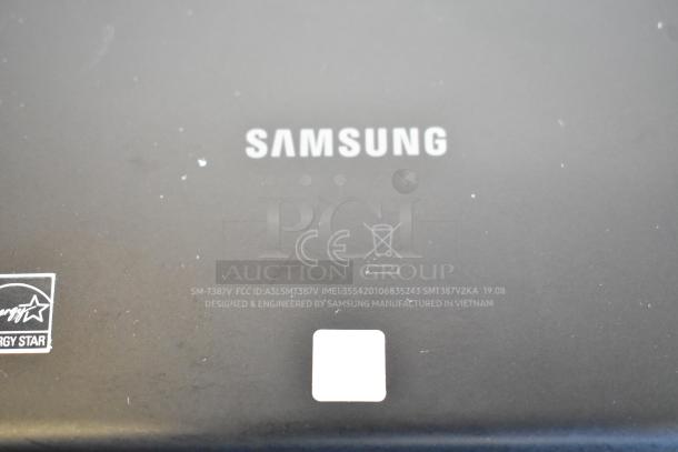 Four Samsung tablets, model SM-T387V, displaying a label with CE marking and Energy Star logo, indicating quality and energy efficiency.