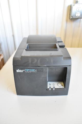 Star TSP100III Receipt Printer, black, shown on a table. Features visible controls and condition appears used.