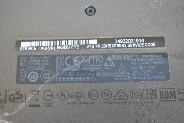 Dell Latitude 7400 laptop label showing service tag BGBVYY2, manufactured in 2019, with power specs and regulatory logos.