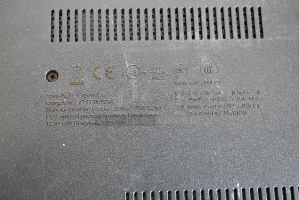 Label on the underside of a Lenovo ThinkPad L15 Gen 1 laptop showing compliance IDs and manufacturing details.