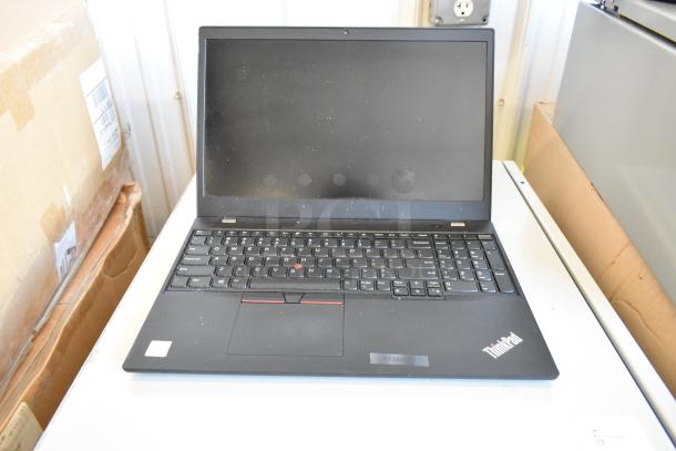 Five various laptops including Dell and HP models, mixed condition, visible wear. Includes a Lenovo ThinkPad on display.