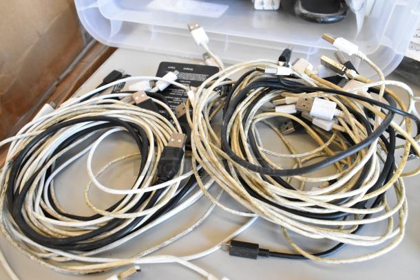 Lot of wires, including USB cables, in varied colors and used condition, with a Govee Wi-Fi Thermo Hygrometer included.