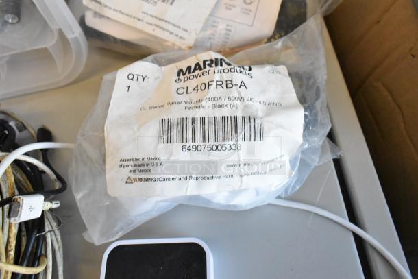 Lot of various items including a Govee WiFi Thermo Hygrometer, wires, and a Marinc power product in packaging.