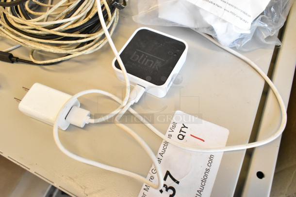 Lot includes Govee Wi-Fi Thermo Hygrometer, Blink sync module, various wires, and a charger; in used condition.