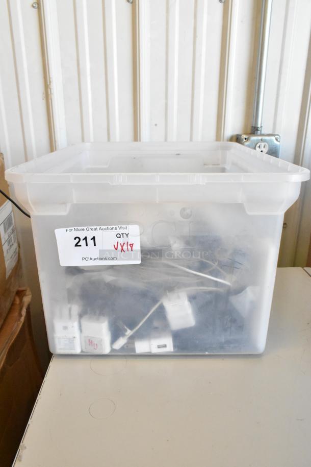 Clear plastic bin containing various electronic items, including a Govee Wi-Fi thermo-hygrometer and wires. Auction label "211."