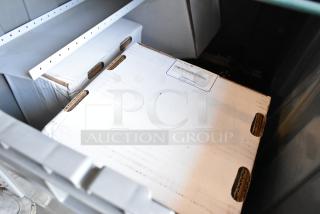 Lot of various items including a StarTech cantilever shelf and Avigilon units in a gray bin. Box shows Avigilon label.