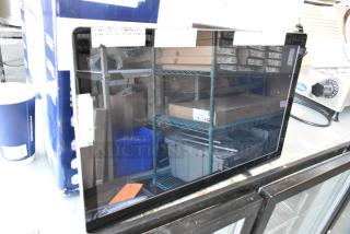 Three Elo monitors on auction, excellent condition, slight warehouse reflections visible.