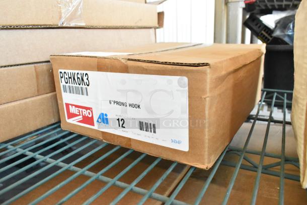 Brand new box of 12 Metro PGHK6K3 6" prong hooks, labeled with product details, on a storage shelf.