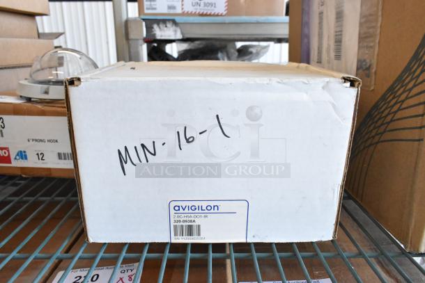 Brand new Avigilon camera in white box, model 2.0C-H5A-DO1-IR, with serial number SN112009023551.