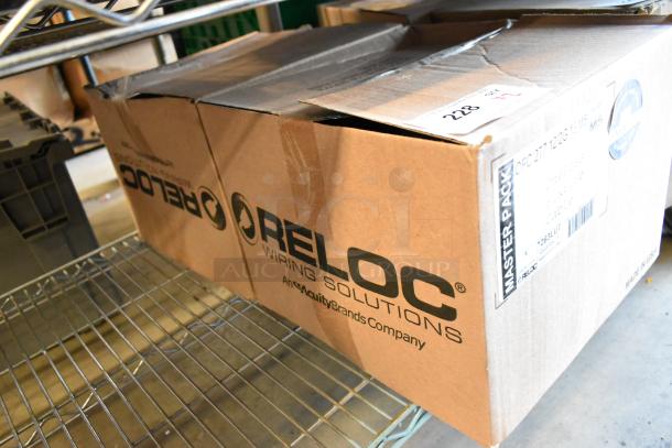 Brand new Reloc OFC 277 12/2G 13 M5 OnePass fixture cable, two boxes, unopened. Labels indicate contents and brand.