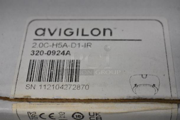 Three brand new Avigilon 2.0C-H5A-D1-IR cameras, sealed in original boxes. Labels show model, barcode, and serial number.