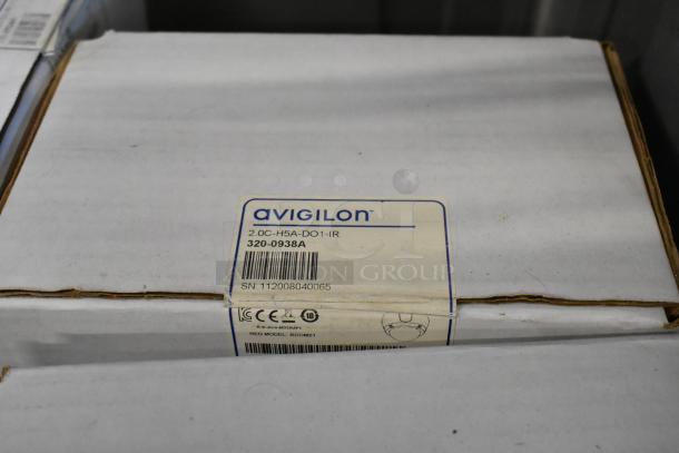 Brand new Avigilon 2.0C-H5A-D1-IR camera in box; label shows model 320-0938A, serial SN: 112008040065.