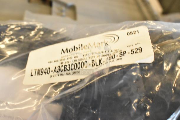 14 Mobile Mark LTM940-A3CB3C000-BLK-180-SP-529 antennas, brand new in packaging, with visible model label.