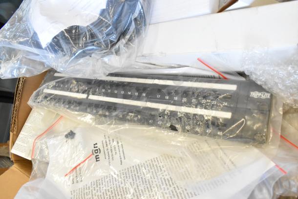 Brand new lot featuring Tripp Lite rack unit, Mobile Mark wires, in sealed packaging, showcasing pristine condition.
