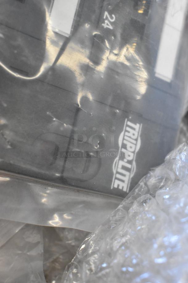Brand new Tripp Lite unit in plastic wrap with partially visible labeling, included in lot with Mobile Mark wires.