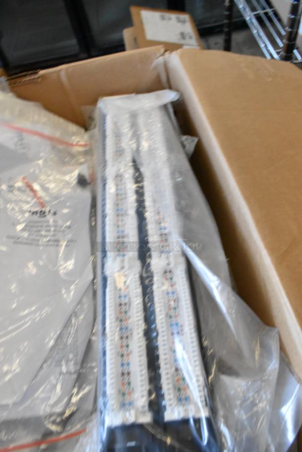 Brand new lot including a Tripp Lite unit and Mobile Mark wires, packaged in plastic and cardboard box.