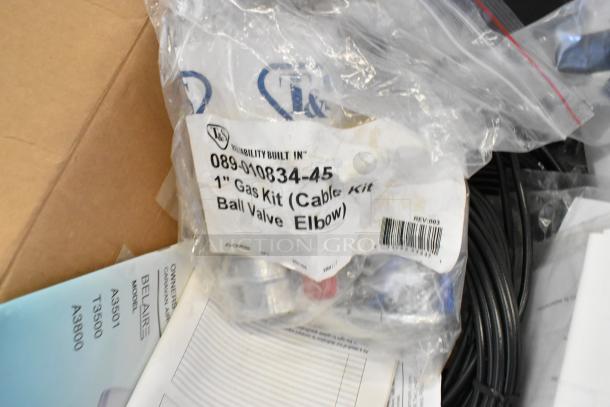 Lot of various new items including a Tripp Lite unit and Mobile Mark wires. Visible is a 1" Gas Kit with a ball valve.