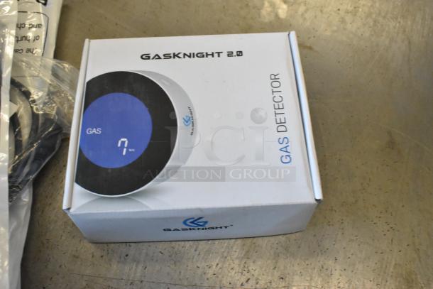 Brand new GASKNIGHT 2.0 gas detector in box, with wires included in sealed packaging.