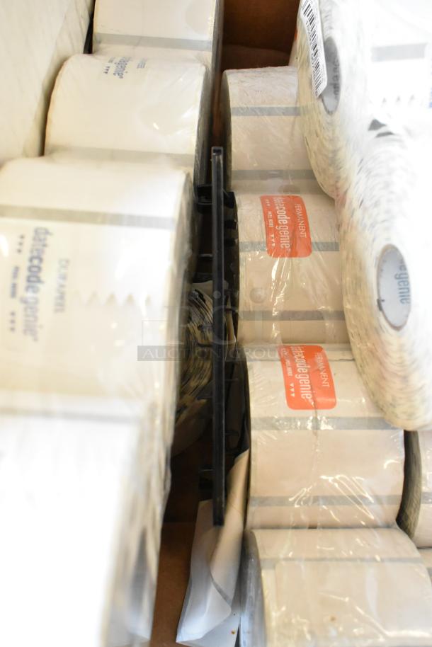 Box containing rolls of labels, brand "datecodegenie," in original packaging, suitable for various labeling needs.