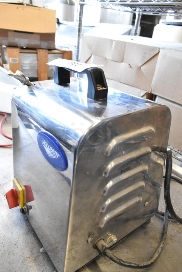 Vollrath MIN0012 stainless steel meat grinder base, 110V, 1 phase, commercial use, with label visible, in used condition.