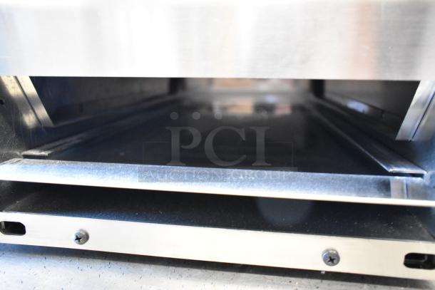 Brand new Prince Castle 464-B toaster, stainless steel, 13 in., single chamber, front loader, 208-240V, 1 phase, minor scratches.