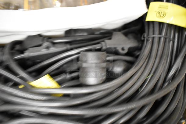 Brand new set of lights with black wiring, bundled and coiled, yellow UL certification tag visible.