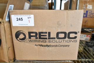 Brand new Reloc OFC 277 12/2G 13 M5 OnePass Fixture Cable in original box. Box labeled with Reloc Wiring Solutions logo.