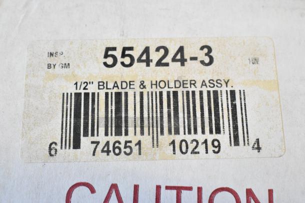 Brand new 55424-3 vegetable pusher blade in box. Label shows "1/2'' Blade & Holder Assy." Includes barcode and inspection by GM.