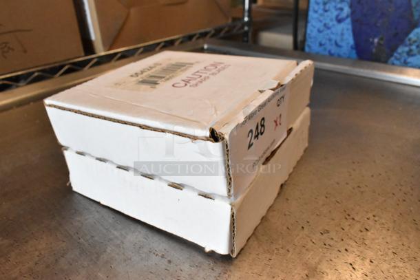 Two new in box 55424-3 vegetable pusher blades. Boxes labeled with caution sticker and auction lot number 248.
