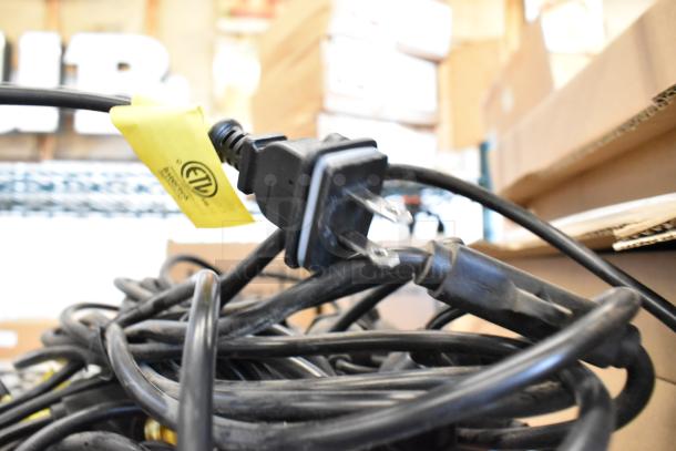 Image of a coiled black electrical wire with a standard two-prong plug. A yellow ETL certification tag is visible, ensuring safety compliance.