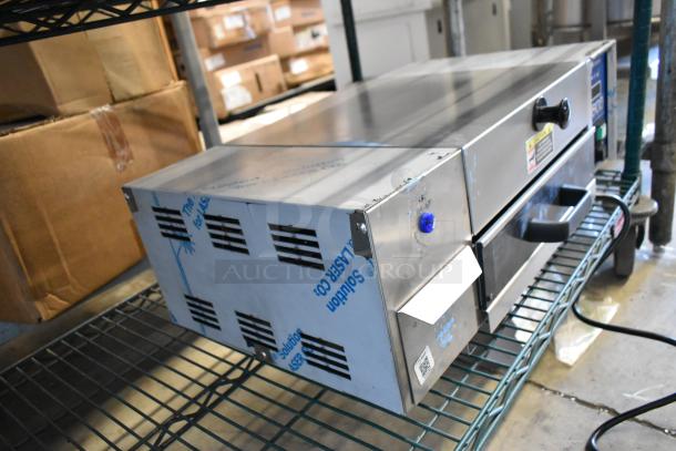 Antunes stainless steel commercial countertop steamer in good condition, featuring control knobs and safety labels, on metal shelf.