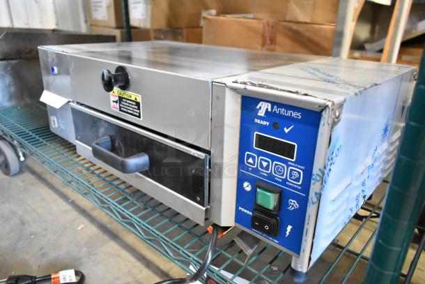 Antunes stainless steel commercial countertop steamer in good condition with control panel, power button, and caution label.