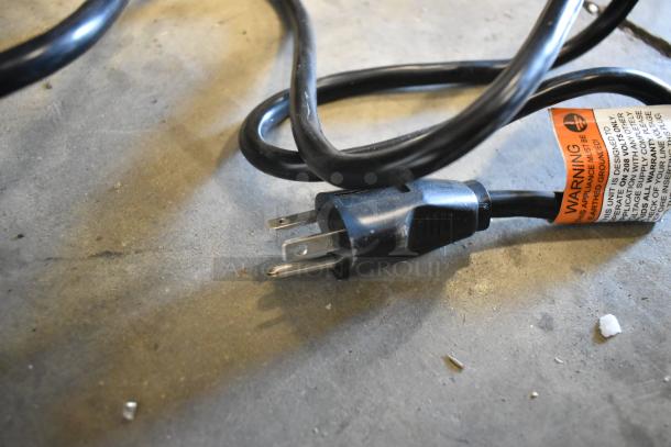 Power cord for Antunes Stainless Steel Commercial Countertop Steamer with warning label visible.
